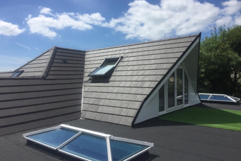 QPH Roofing flat roof with roof light and tiled dormer on residential property in South England
